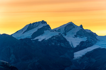 Fototapeta na wymiar Beautiful sunrise colours above a mountain range