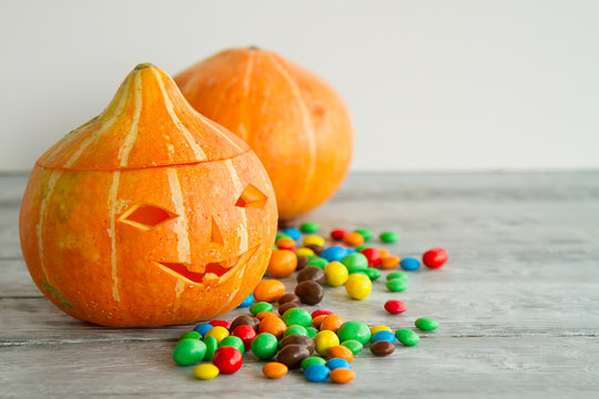 funy pumpkin and colorful candy for Halloween
