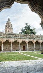 Fototapeta na wymiar View of the bell tower of the cathedral of Salamanca from the cloister of the smaller schools of the university
