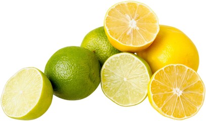 Heap of limes and lemons isolated on white background