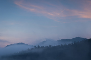 Misty sunrise in the mountains of Pai, Thailand