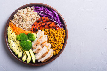 Buddha bowl with avocado , chicken , pepper , quinoa and chickpea