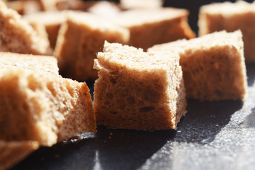 Bread crumbs on a metal baking sheet.