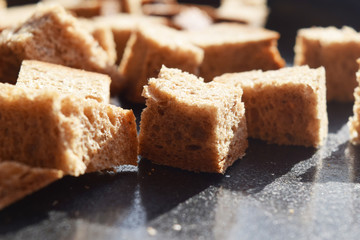 Bread crumbs on a metal baking sheet.