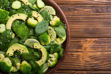 Green baby spinach salad with avocado