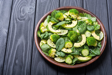 Green baby spinach salad with avocado
