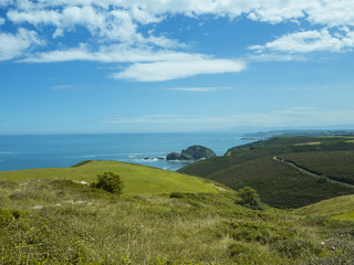 Fototapeta na wymiar Paisaje de costa del Faro Cabo de Peñas en Asturias, España, verano de 2018
