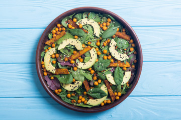 Baby spinach salad with sweet potato , chickpeas and avocado