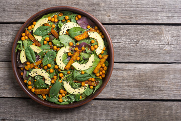 Baby spinach salad with sweet potato , chickpeas and avocado