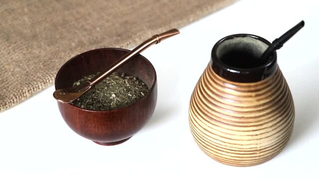 Yerba mate preparation. Putting bombilla to matero before adding water.
