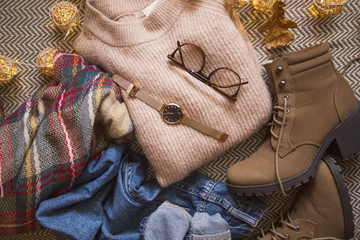 Autumn fashion clothing , outfit idea with sweater, boots and jeans