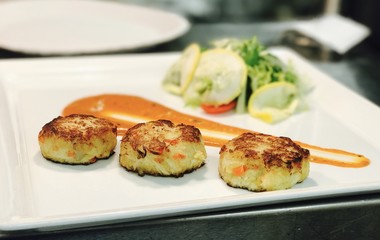 Crab cake and cream sauce and delicious salad 