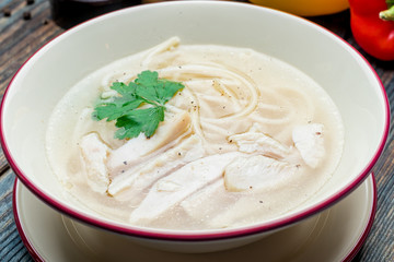 Chicken soup bouillon in a plate