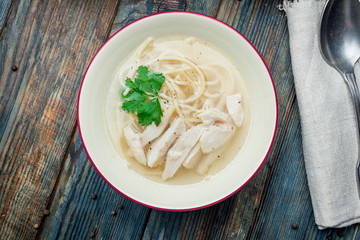 Chicken soup bouillon in a plate