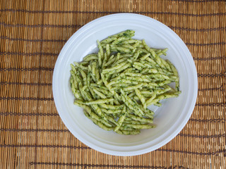 dish of trofie al pesto: handmade pasta with basil sauce