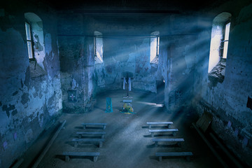 Mysterious church interior with moonlight beams in the night.