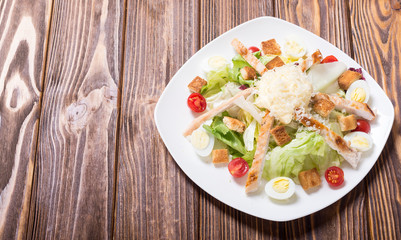 Salad ceasar with chicken , eggs and tomatoes
