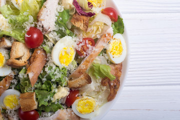 Salad ceasar with chicken , eggs and tomatoes