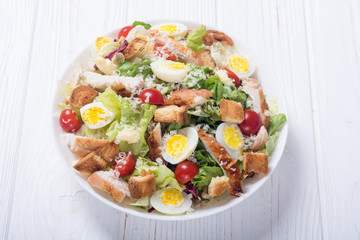 Salad ceasar with chicken , eggs and tomatoes