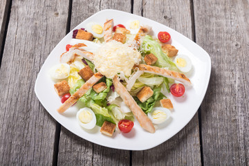 Salad ceasar with chicken , eggs and tomatoes