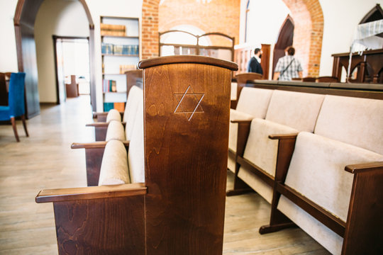 Star of David, Jewish symbol on wooden bench or chair in synagogue