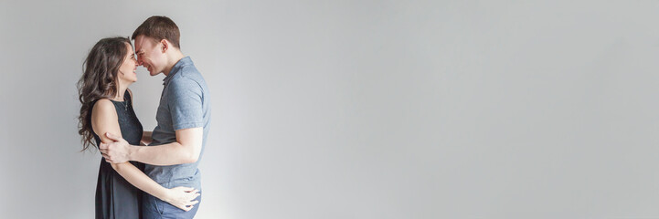 Couple in love having nice time together. Young happy woman hugging boyfriend, white background. Students, bride, groom, engagement, relationship, aspirations, supporting relying concept Banner