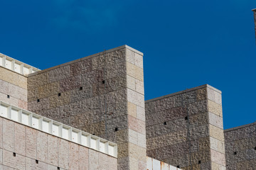 Detail of modern architecture public building facade against blue sky