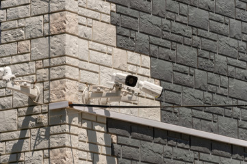 street video camera on the wall of a building