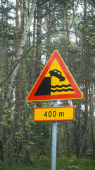 road sign danger car falling of