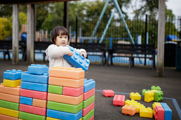 Fototapeta na wymiar Baby girl play at outdoor playground