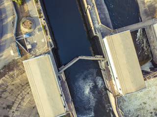 Fototapeta na wymiar aerial drone shot of river gateway structure for barge cargo ships f