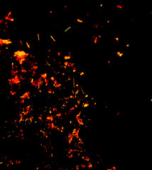 Flame of fire with sparks on a black background