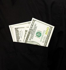 money in the pocket of a shirt