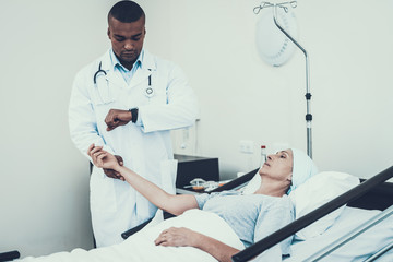 Doctor Measuring Pulse. Patient on Rehabilitation.