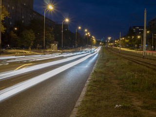 Night road light ribbons on the asphalt