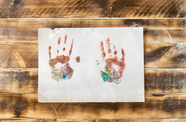 children with paint apply their own imprint on paper