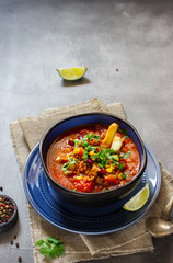 Chili soup in blue bowl.