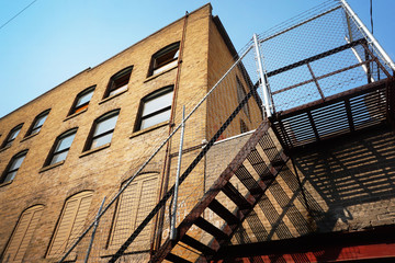 urban building with fenced off stairway