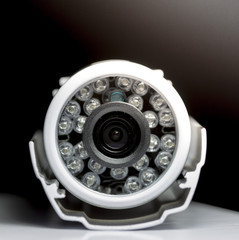 Surveillance cameras for sale photographed on a black background