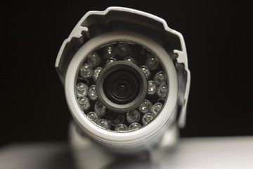 Surveillance cameras for sale photographed on a black background