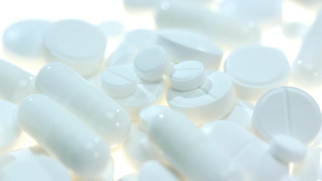 Pharmaceutical drugs. Medical pills and capsules. Medicine healthcare. Medicaments background. White pills and tablet. Pharmaceutical industry. Health care industry