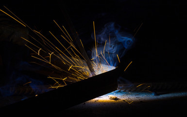 Flash and sparks from electric welding