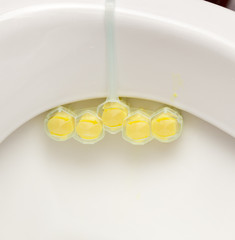 Yellow, washing, toilet gel in a small tube