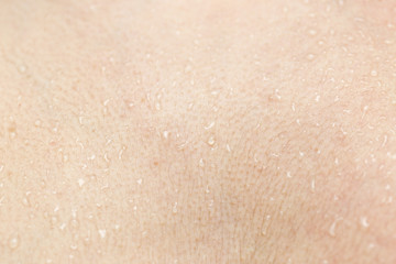 Fototapeta premium Wet human skin with a drop of water