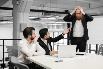 Young people at meeting in modern office