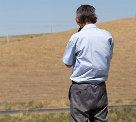 Naklejka premium a man in a field thinking