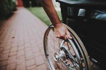 Fototapeta premium Cancer Patient on a Wheelchair. Remission. Clinic.