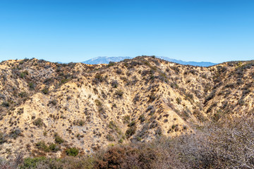 Fototapeta na wymiar Dry summer hillsides with Mt. Baldy in the background