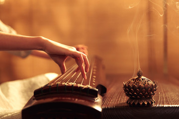 Young woman playing the lyre