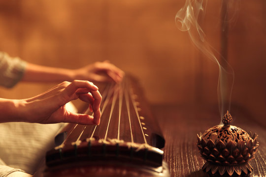 Young woman playing the lyre